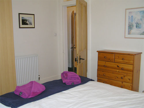 Back bedroom with a view to the shared gardens