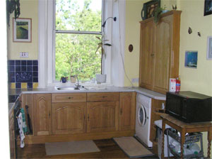 Fully fitted kitchen, with view to rear gardens