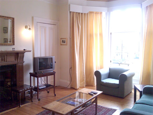 Front living room with view to Marchmont Crescent and junction with Warrender Park Road